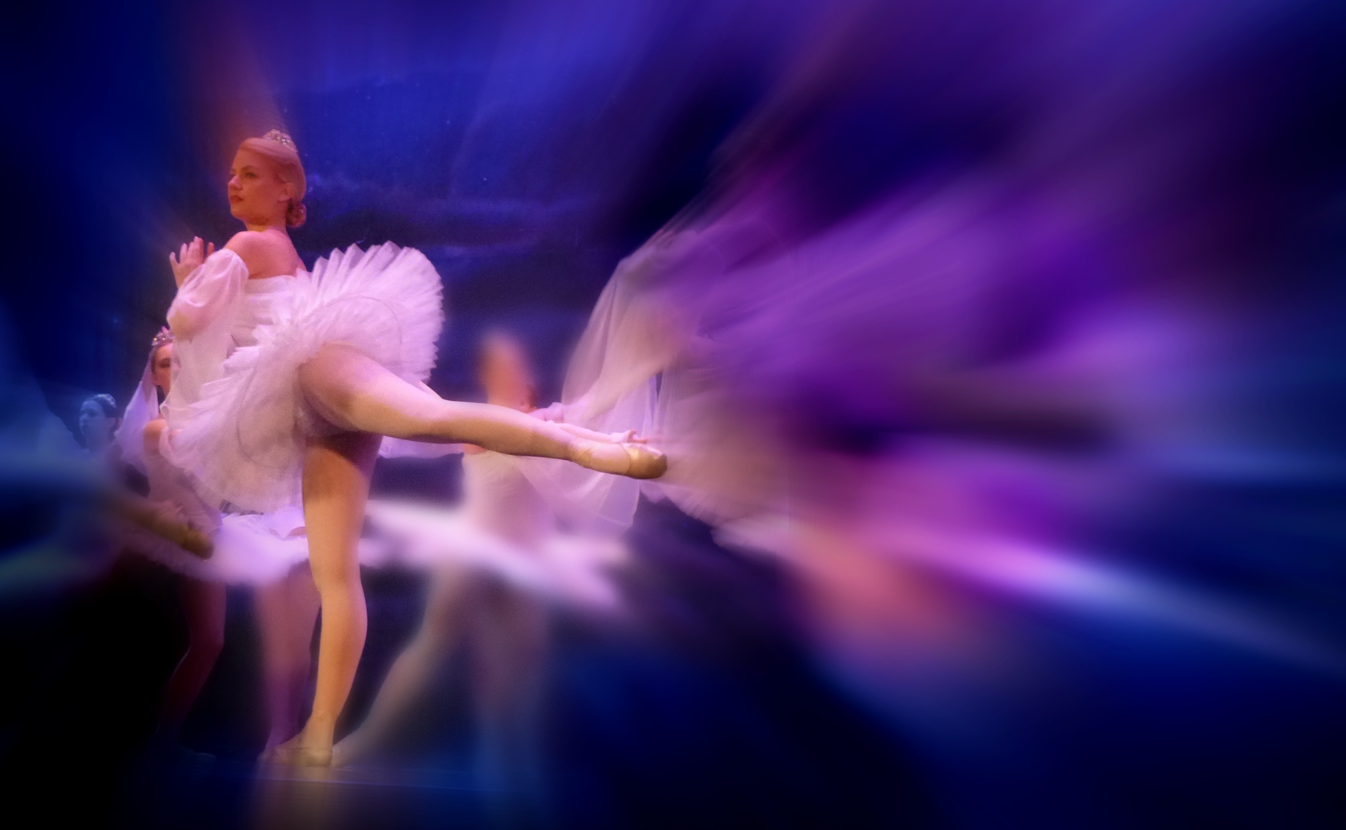 Classical ballet students in arabesque